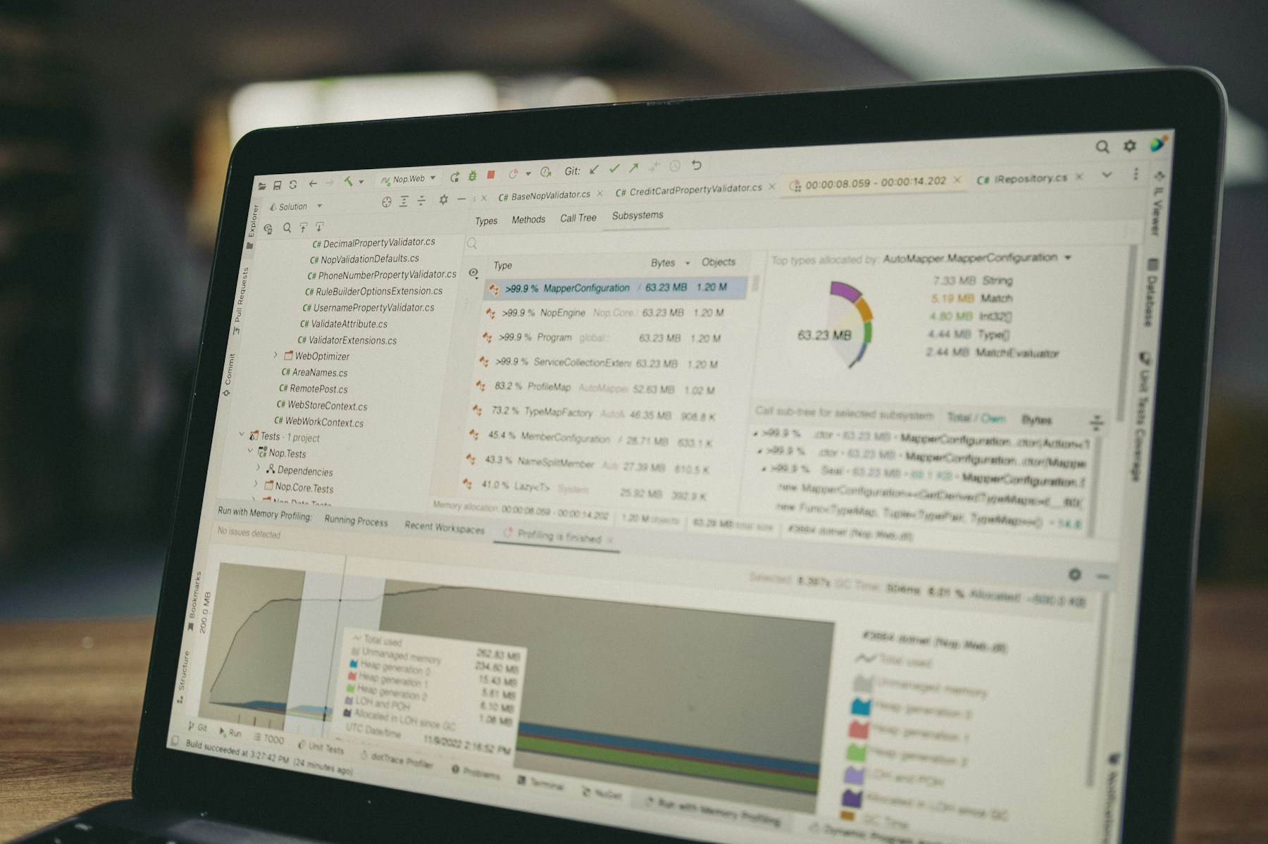 Laptop screen with code and data charts representing full stack development.